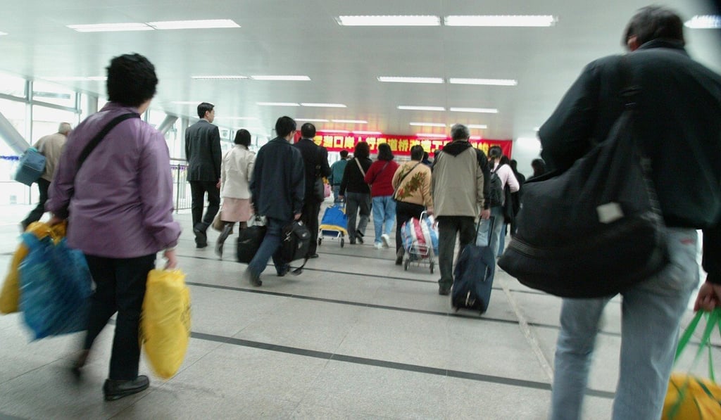People cross the Shenzhen border in Lo Wu. Many elderly Hongkongers have chosen to retire on the mainland, but some have returned to Hong Kong for medical treatment. Photo: SCMP