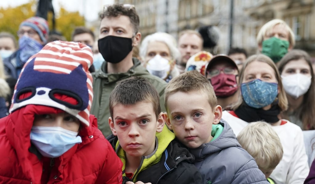 People watch as Swedish climate activist Greta Thunberg goes on the stage at the end of a demonstration in Glasgow on Friday. Photo: AP People watch as Swedish climate activist Greta Thunberg goes on the stage at the end of a demonstration in Glasgow on Friday. Photo: AP