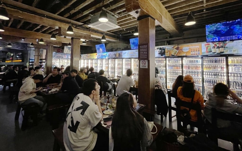 Hundreds of young esports fans gathered at a bar in Shanghai on the evening of November 6, 2021, to watch the finals of this year's League of Legends World Championship, which was won by China's Edgar Gaming team. Photo: Tracy Qu