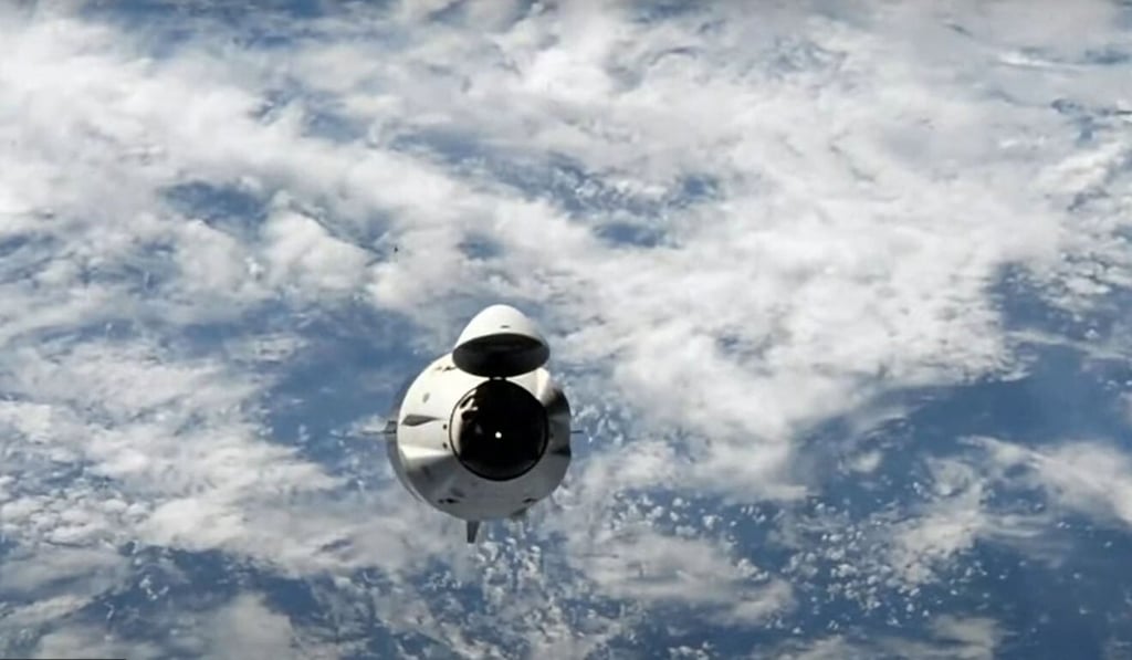 The SpaceX Dragon capsule as it returns to Earth. Photo: AP