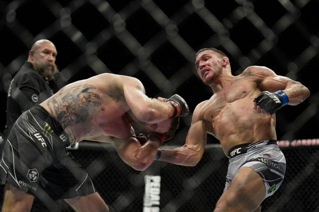 Michael Chandler (right) lands a punch against Justin Gaethje during their lightweight bout at UFC 268. Photo: AP Michael Chandler (right) lands a punch against Justin Gaethje during their lightweight bout at UFC 268. Photo: AP