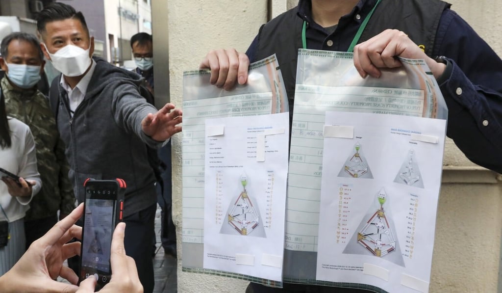 A customs officer displays some of the evidence seized on Tuesday. Photo: Felix Wong