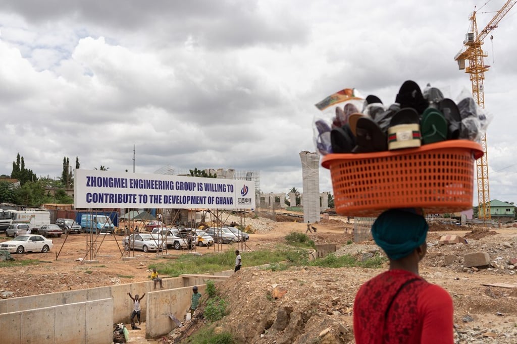 A woman walks past a Chinese construction site for a new flyover in the outskirts of Accra, Ghana. File photo: Ruom