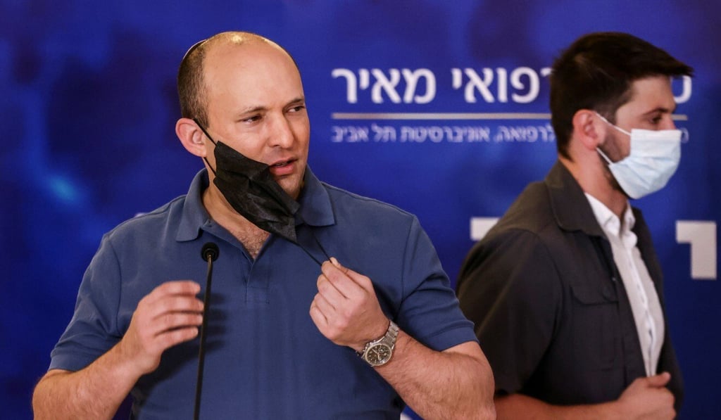 Israeli Prime Minister Naftali Bennett arrives to receive a third shot of the Covid-19 vaccine in Kfar Saba, Israel in August. Photo: Reuters