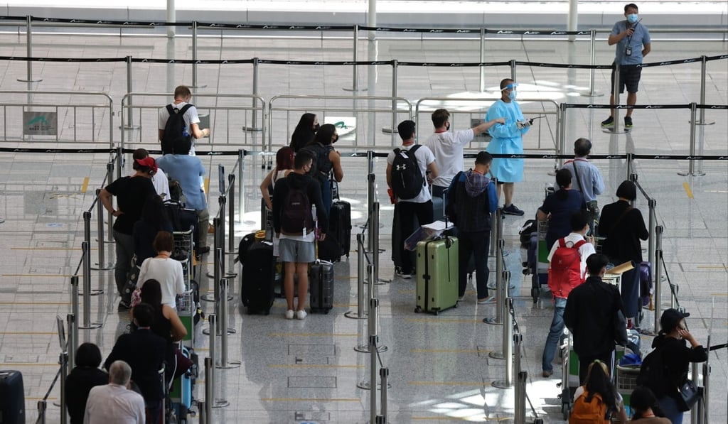 Travellers arriving at Hong Kong International Airport wait to be transported to quarantine hotels. Photo: Nora Tam