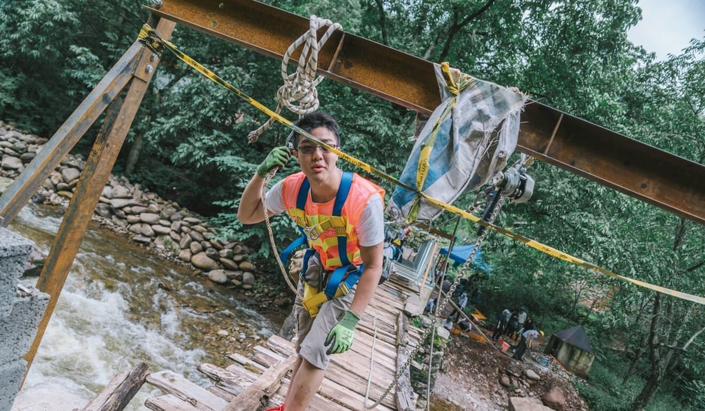Wong Chung-shing helped build a footbridge during his first trip to the mainland with the foundation. Photo: Wu Zhi Qiao Charitable Foundation
