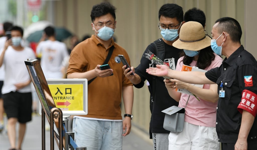 People scan a QR code to enter a shopping mall in Chengdu. Photo: VCG via Getty Images People scan a QR code to enter a shopping mall in Chengdu. Photo: VCG via Getty Images