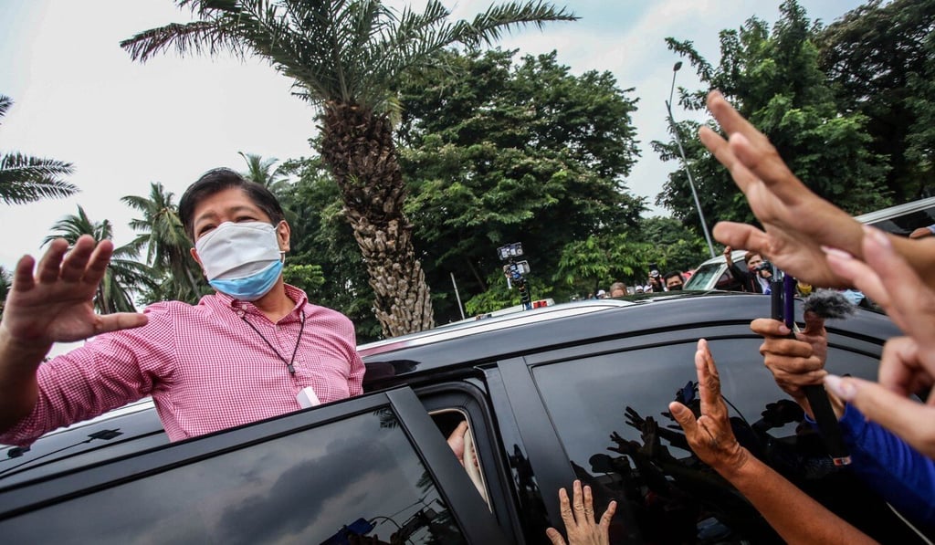 Former Philippine senator Ferdinand “Bongbong” Marcos Jnr, son of former dictator Ferdinand Marcos, waves at supporters after filing his candidacy papers for the country’s 2022 presidential race. Photo: AFP Former Philippine senator Ferdinand “Bongbong” Marcos Jnr, son of former dictator Ferdinand Marcos, waves at supporters after filing his candidacy papers for the country’s 2022 presidential race. Photo: AFP