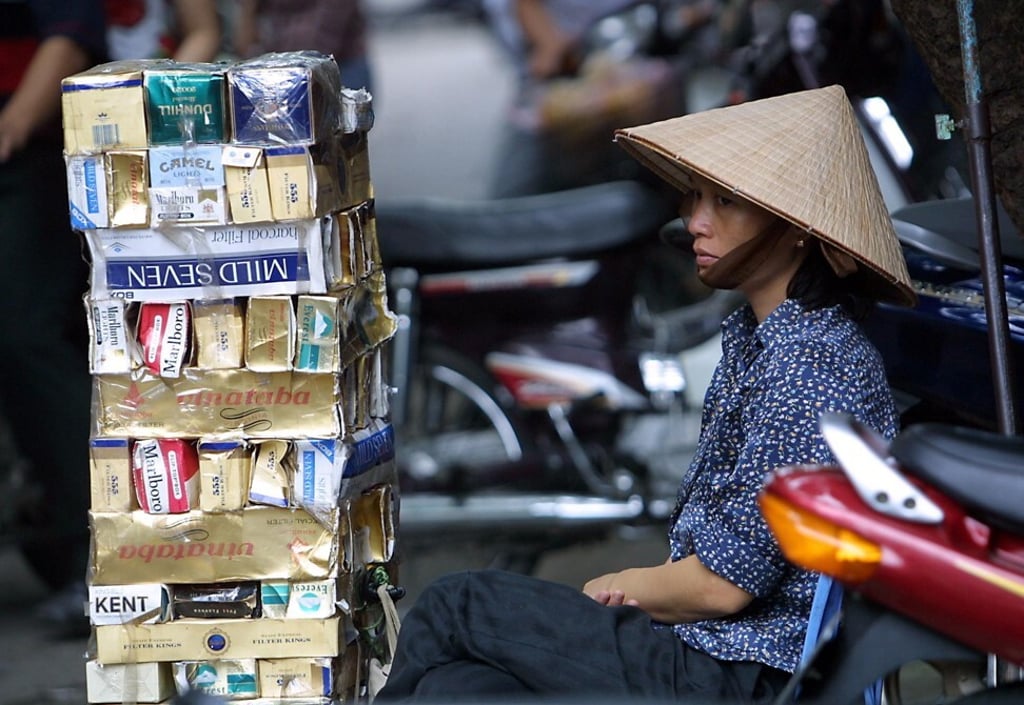 A cigarette vendor seen at a street in Hanoi, Vietnam. Photo: AFP A cigarette vendor seen at a street in Hanoi, Vietnam. Photo: AFP