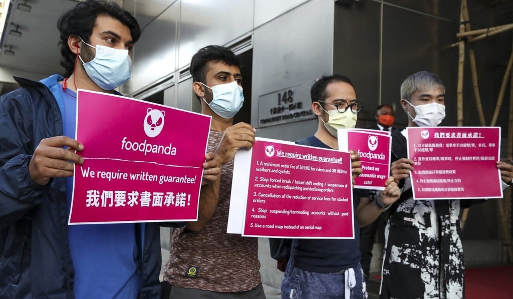 Foodpanda couriers gather outside the company’s headquarters in Sheung Wan. Photo: Edmond So Foodpanda couriers gather outside the company’s headquarters in Sheung Wan. Photo: Edmond So