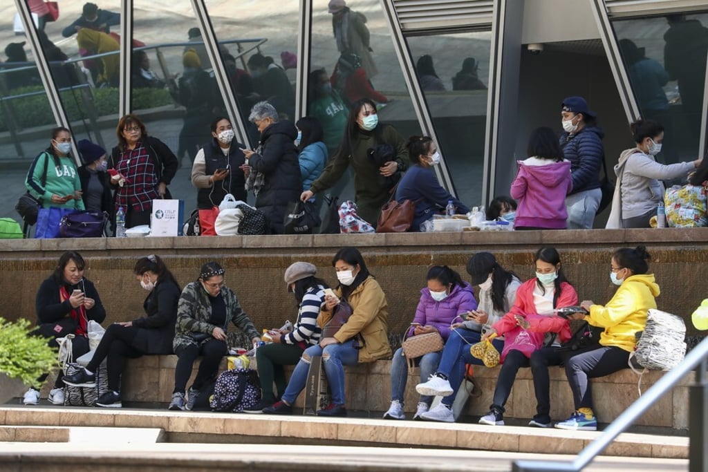 Foreign domestic helpers enjoy a day out in Central, Hong Kong. Photo: SCMP / Jonathan Wong