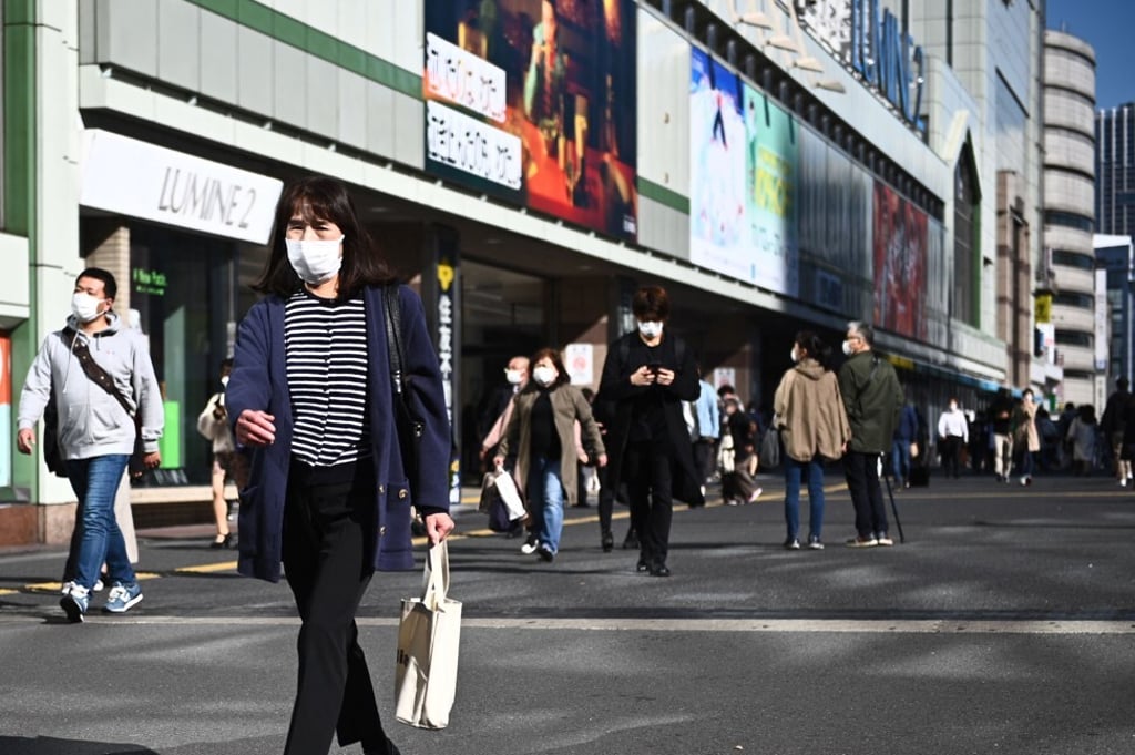 Pedestrians outside Shinjuku station in Tokyo. Photo: AFP