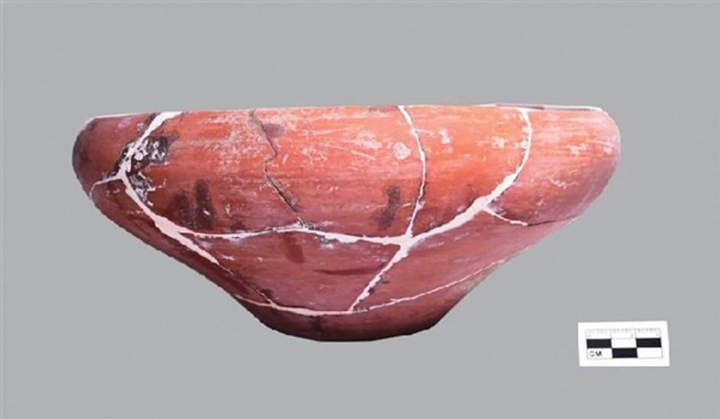 An unearthed red pottery bowl from the Yangshao culture relic site in central China. Photo: Taiyuan Institute of Cultural Relics and Archaeology An unearthed red pottery bowl from the Yangshao culture relic site in central China. Photo: Taiyuan Institute of Cultural Relics and Archaeology
