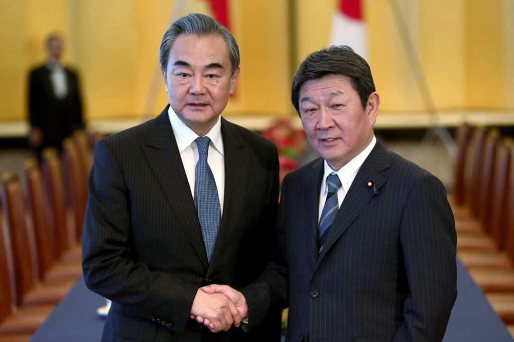 Chinese Foreign Minister Wang Yi, left, pictured with former Japanese Foreign Minister Toshimitsu Motegi in Tokyo on November 25, 2019. Photo: AP