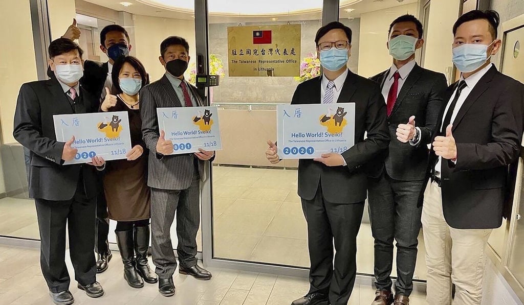Eric Huang (third right), director, poses with other staff of the Taiwanese Representative Office. Photo: Handout via AP Eric Huang (third right), director, poses with other staff of the Taiwanese Representative Office. Photo: Handout via AP