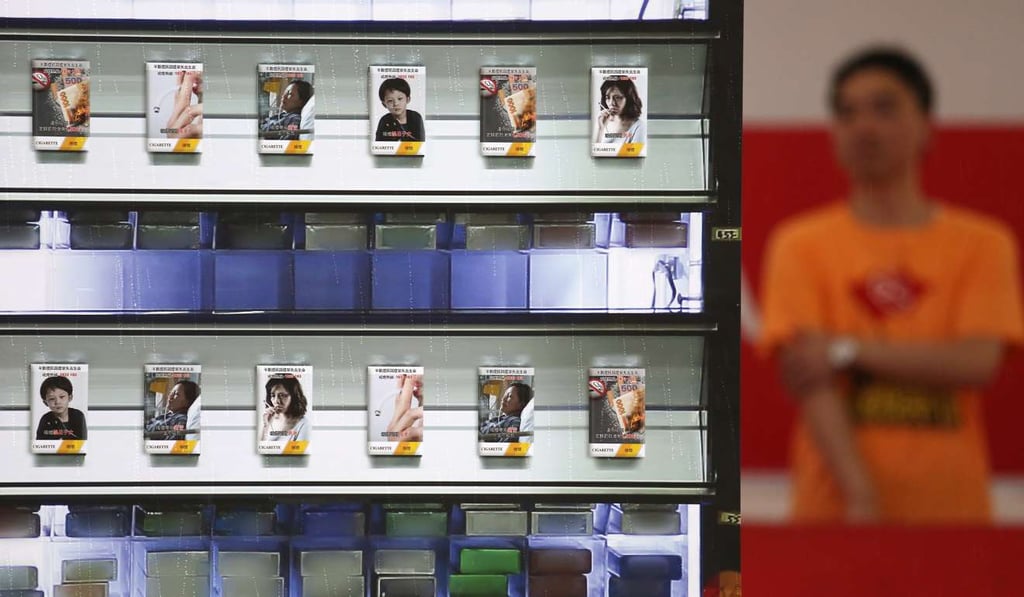 Mock-ups of cigarette packs are displayed at an event organised by anti-tobacco campaigners in 2015. The Hong Kong government plans to increase the size of the warning label from 50 per cent to 85 per cent of every cigarette pack. Photo: Nora Tam