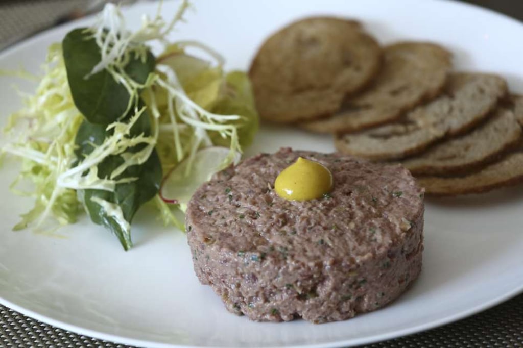 Polmard beef tartare with bread crisps and mixed leaves. Photo: Jonathan Wong