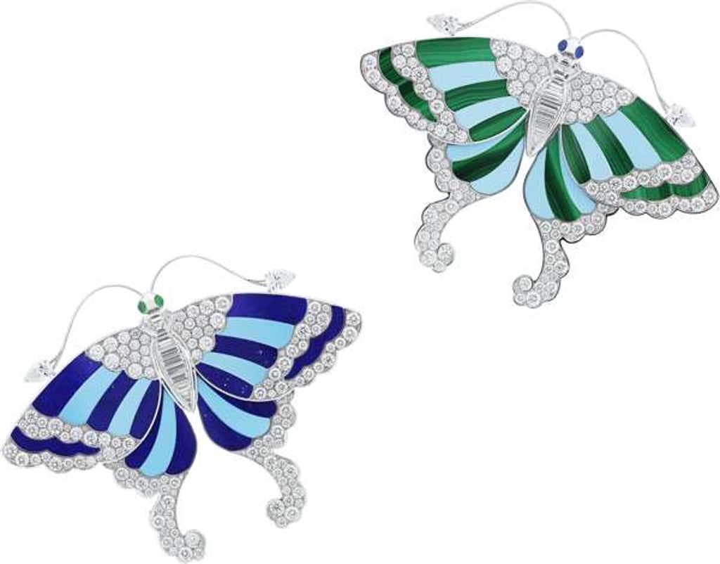 Butterfly brooches part of Van Cleef & Arpel's Noah's Ark exhibition. The butterfly on the left features tuquoise and lapis lazuli, while teh butterfly on the right feature turquoise and malachite.