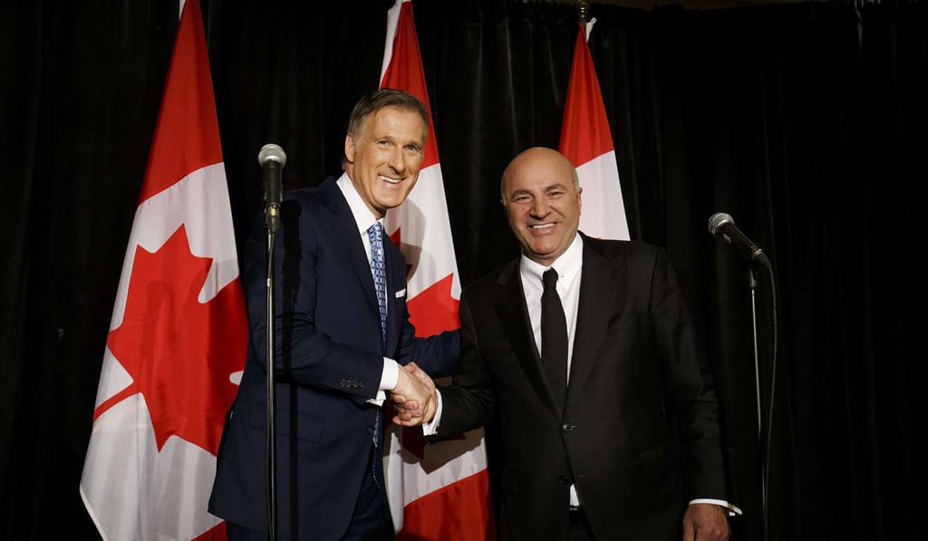 Maxime Bernier, left, shakes hands with Kevin O'Leary, who is quitting the federal Conservative leadership race and throwing his support behind Bernier. Photo: Bloomberg