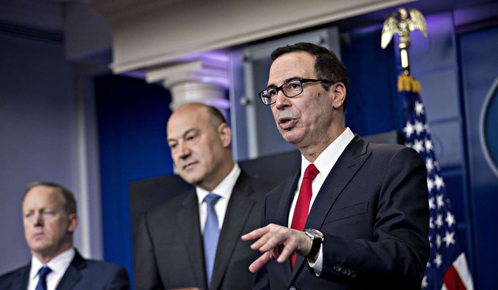 US Treasury Secretary Steven Mnuchin speaks as Gary Cohn, director of the US National Economic Council, centre, and Sean Spicer, White House press secretary, left, listen during the White House press briefing on President Donald Trump's call to slash the corporate tax rate to 15 per cent. Photo: Bloomberg US Treasury Secretary Steven Mnuchin speaks as Gary Cohn, director of the US National Economic Council, centre, and Sean Spicer, White House press secretary, left, listen during the White House press briefing on President Donald Trump's call to slash the corporate tax rate to 15 per cent. Photo: Bloomberg