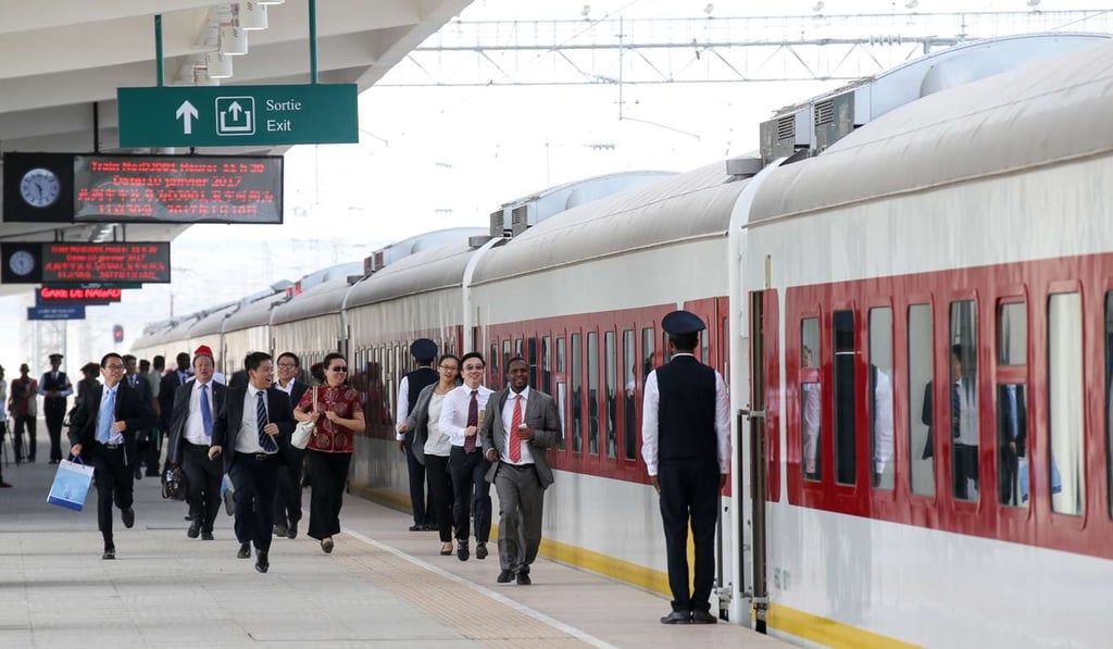 Passengers rush to make the first train of the Addis Ababa-Djibouti Railway at Gare De Nagad station in Djibouti, on January 10. The railway was built by the China Railway Group and the China Civil Engineering Construction Corporation. Photo: Felix Wong