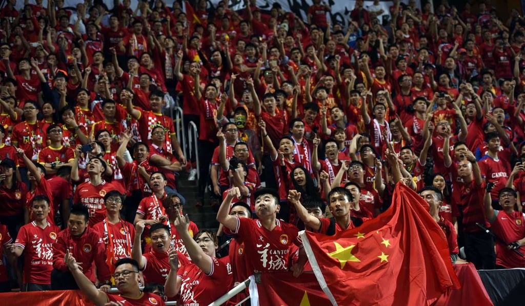 Fans of China's Guangzhou Evergrande chant slogans against fans of Hong Kong's Eastern. Photo: AFP
