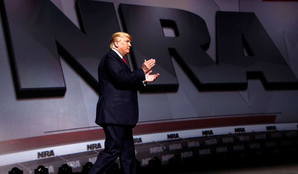 US President Donald Trump arrives onstage to deliver remarks at the National Rifle Association (NRA) Leadership Forum. Photo: Reuters