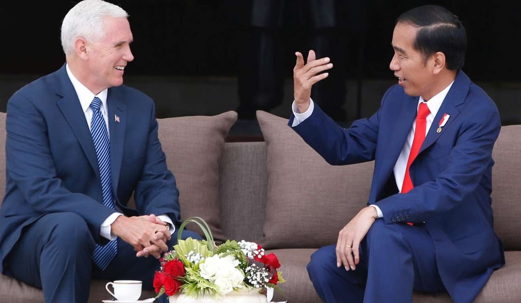 US Vice-President Mike Pence chats with Indonesian President Joko Widodo in Jakarta. Photo: Reuters