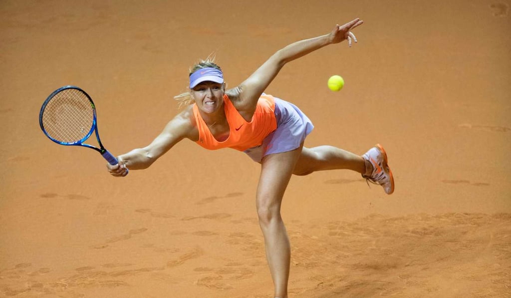 Maria Sharapova returns to Kristina Mladenovic. Photo: AFP
