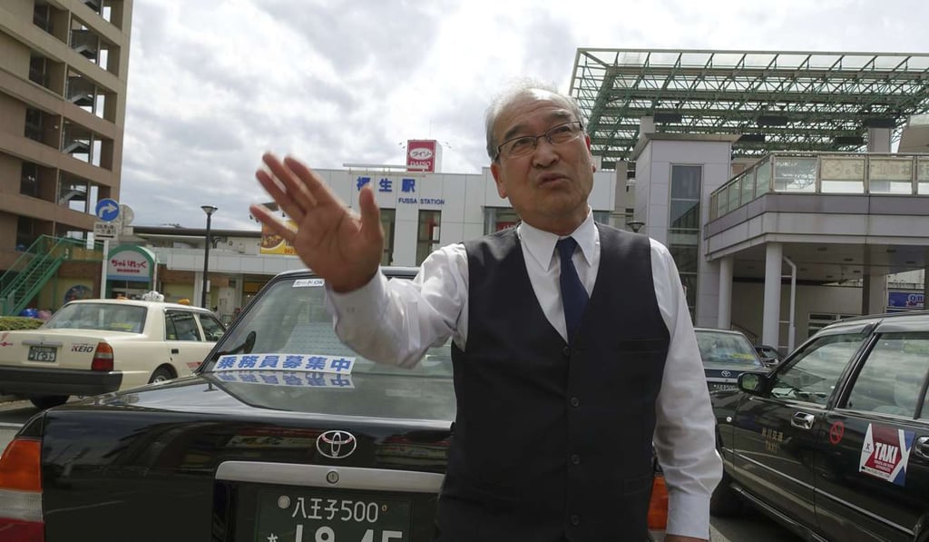 Taxi driver Seijiro Kurosawa: ‘all we can do is run into a department store perhaps’. Photo: AP