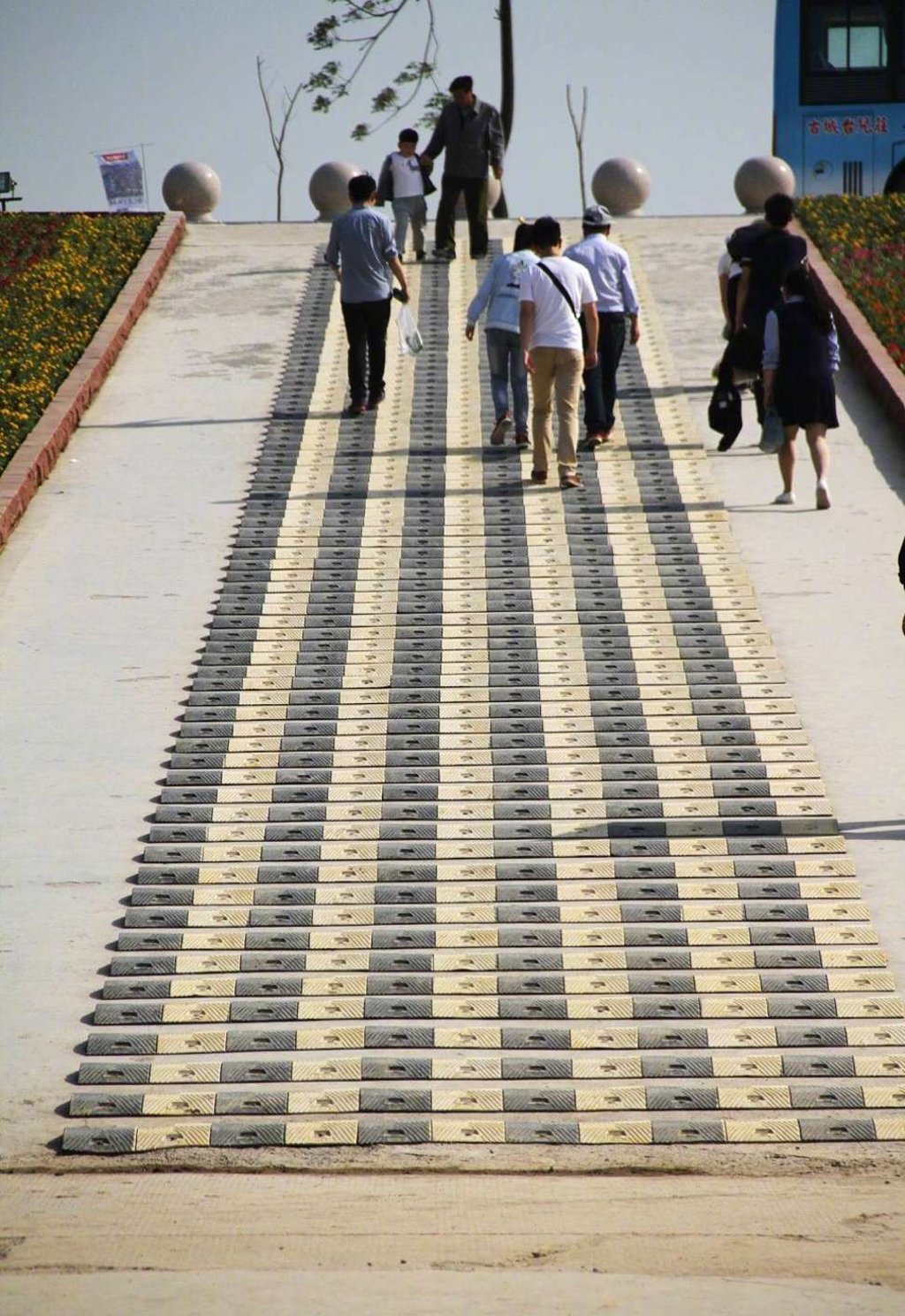 Each black-and-yellow speed bump is located just one small step away from the other and the features stretch several metres along the path. Photo: Handout