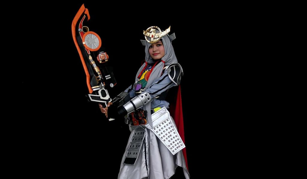 Ange, a young Indonesian Muslim cosplayer dressed as the Kamen rider Gaim, takes part in the Hijab Cosplay event in Subang Jaya. Photo: AFP
