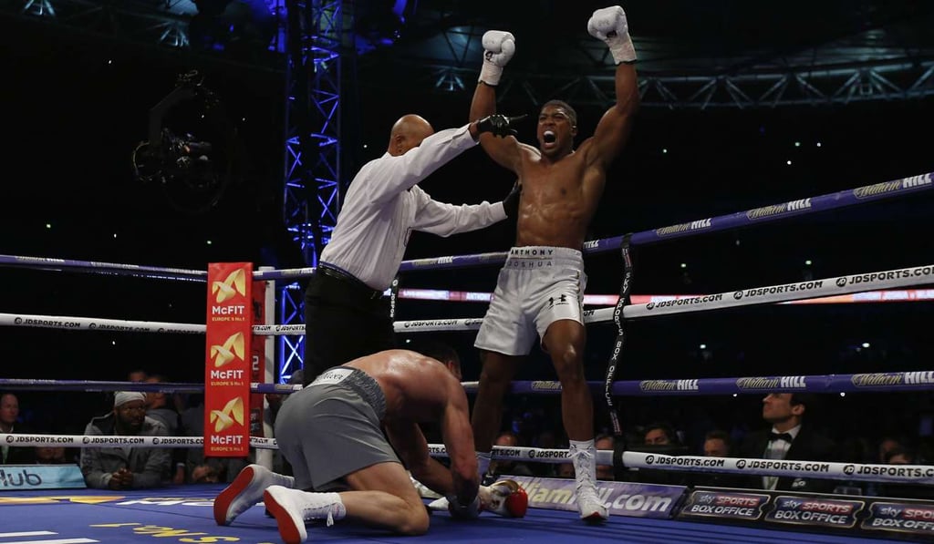 Anthony Joshua knocks down Wladimir Klitschko. Photo: Reuters