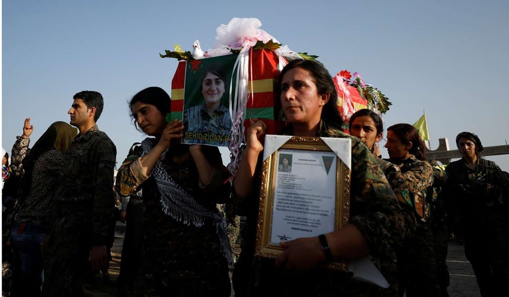 Fighters from the Kurdish People's Protection Units (YPG) in the Syrian Kurdish town of Derik carry the coffin of a fellow fighter, who was killed in Turkish airstrikes on the headquarters of the YPG in Mount Karachok, at her funeral on Saturday. Photo: Reuters