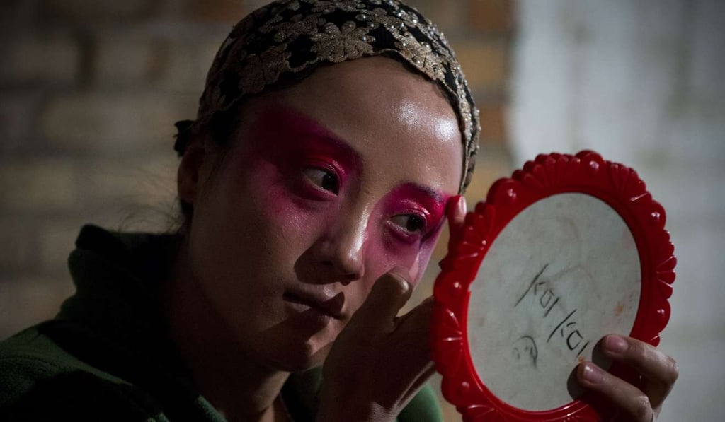 A performer preparing backstage for the show. Photo: AFP A performer preparing backstage for the show. Photo: AFP