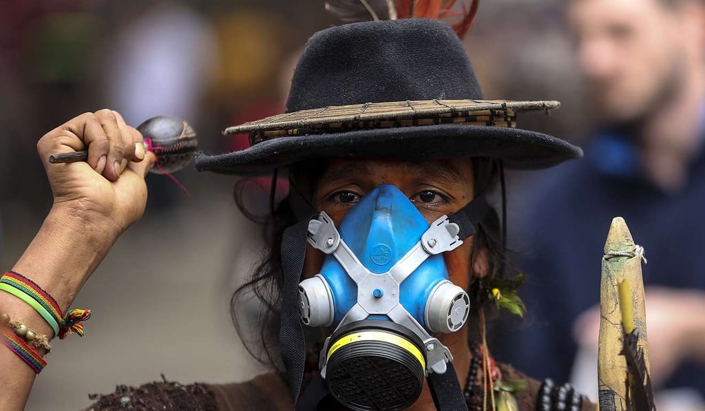 Indigenous tribe members join demonstrators to protest in front of the Assembly of Deputies in Rio de Janeiro, Brazil, on Friday. Photo: EPA