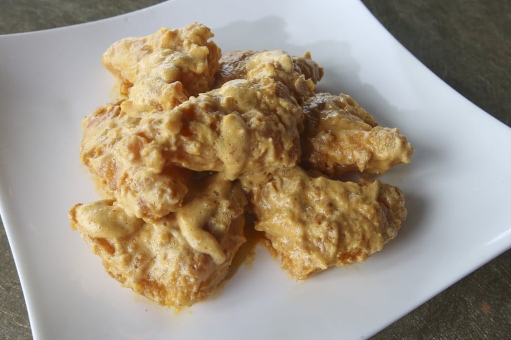 Deep fried squid with salted egg yolk. Photo: David Wong