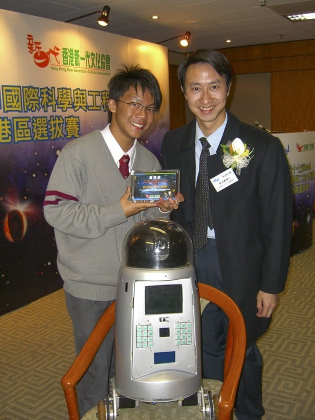 Chan Yik-hei, with the Hong Kong New Generation Cultural Association’s Dr Jimmy Wong, after receiving his Intel International Science and Engineering Fair award, in 2005, for his robot Total Equip. Picture: Intel ISEF