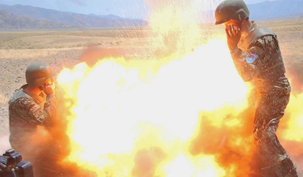 This photo is the penultimate image captured US Army photographer Hilda Clayton. She was killed by the mortar tube explosion that it depicts. Photo: EPA