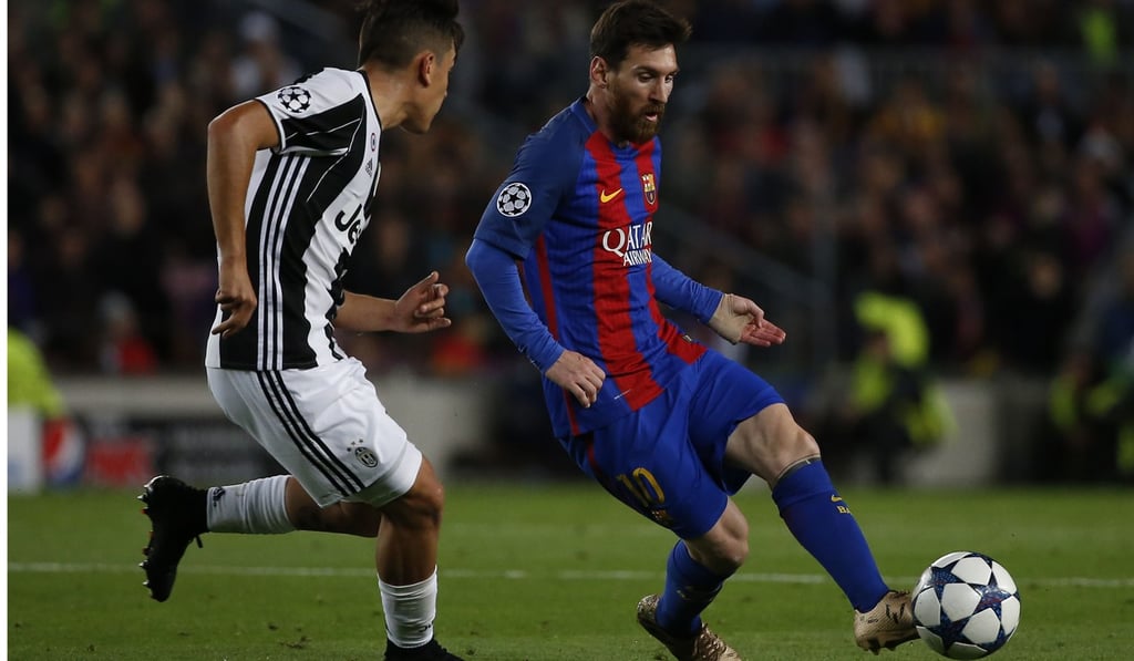 Lionel Messi (right) fights for the ball with Juventus' forward Paulo Dybala during their Uefa Champions League quarter-final second leg at the Camp Nou stadium in Barcelona. Photo: AFP