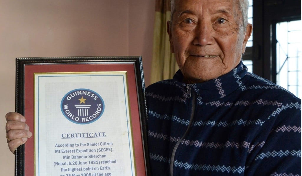 Min Bahadur Sherchan shows off his 2008 Guinness World Record certificate for being the oldest person to summit Mount Everest – a record that was later broken in 2013. Photo: AFP