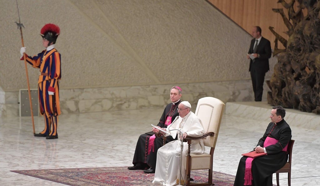 A Swiss Guard stands to the right of Pope Francis. Photo: AFP A Swiss Guard stands to the right of Pope Francis. Photo: AFP