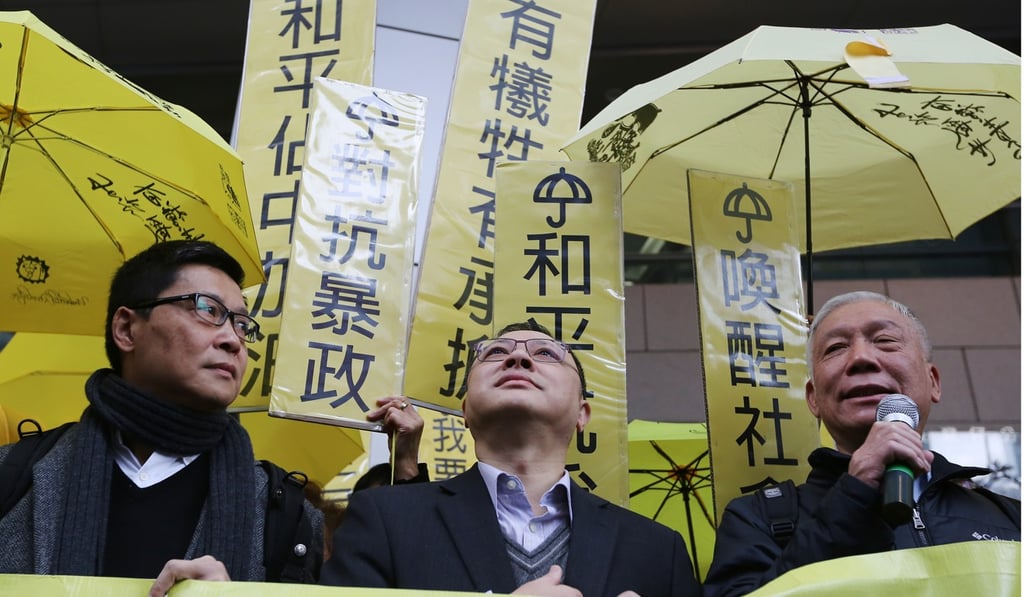 The three founders of Occupy Central, (from left) Chan Kin-man, Benny Tai and Chu Yiu-ming, seen outside police headquarters in Wan Chai in January 2015. The three were arrested, then released, as the police continued their investigation into the civil movement. Photo: Sam Tsang