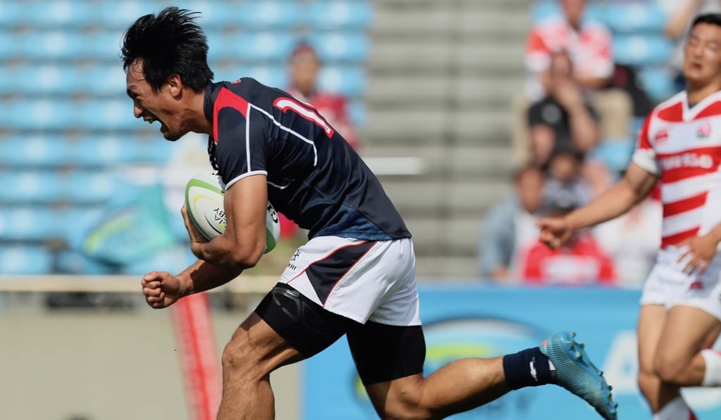 Salom Yiu Kam-shing scores Hong Kong’s opening try against Japan. Photo: Kenji Demura, Rugby Japan