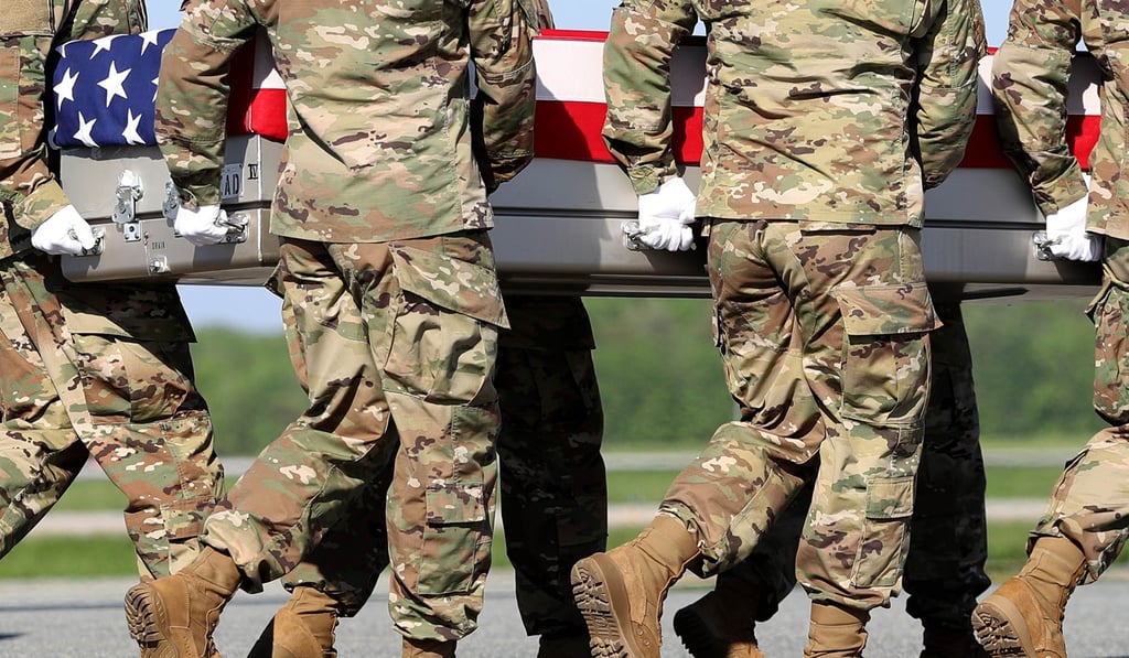 US Army soldiers carry the flag-draped casket of a US Army Ranger killed in a raid in Nangarhar Province. Photo: AFP US Army soldiers carry the flag-draped casket of a US Army Ranger killed in a raid in Nangarhar Province. Photo: AFP