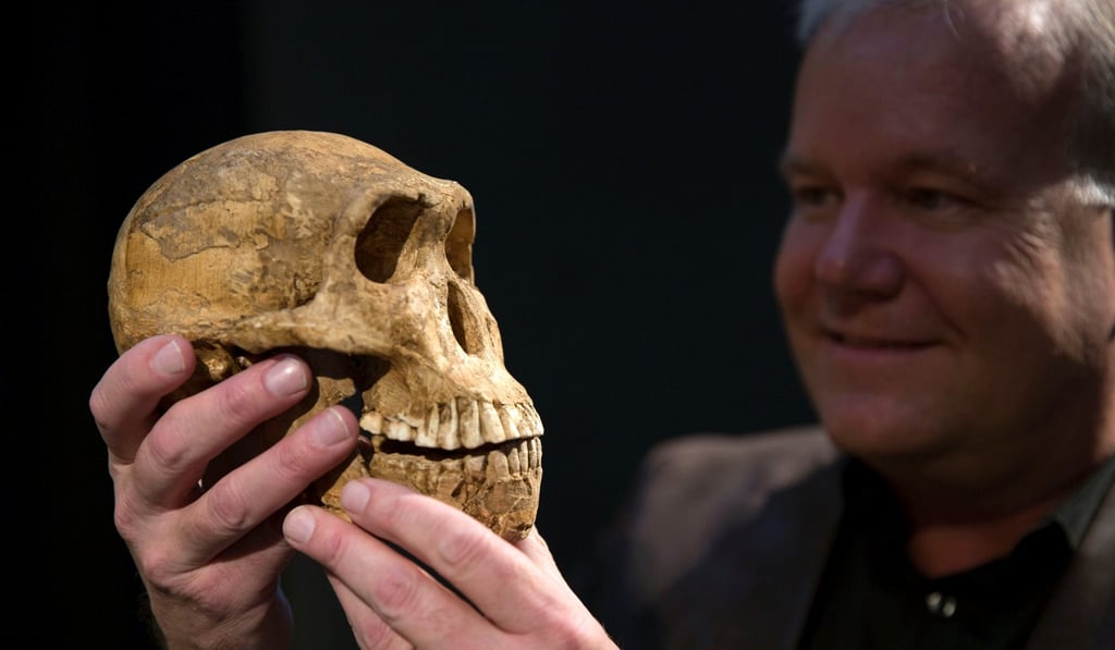 Professor Lee Berger holds a cast of the new Homo naledi skull at the Cradle of Humankind World Heritage site near Johannesburg, South Africa,on Tuesday. Photo: Reuters