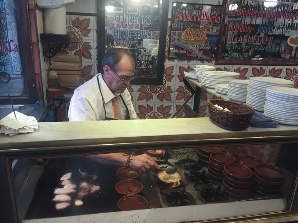 Making gambas al ajillo at La Casa del Abuelo. Photo: Chris Dwyer