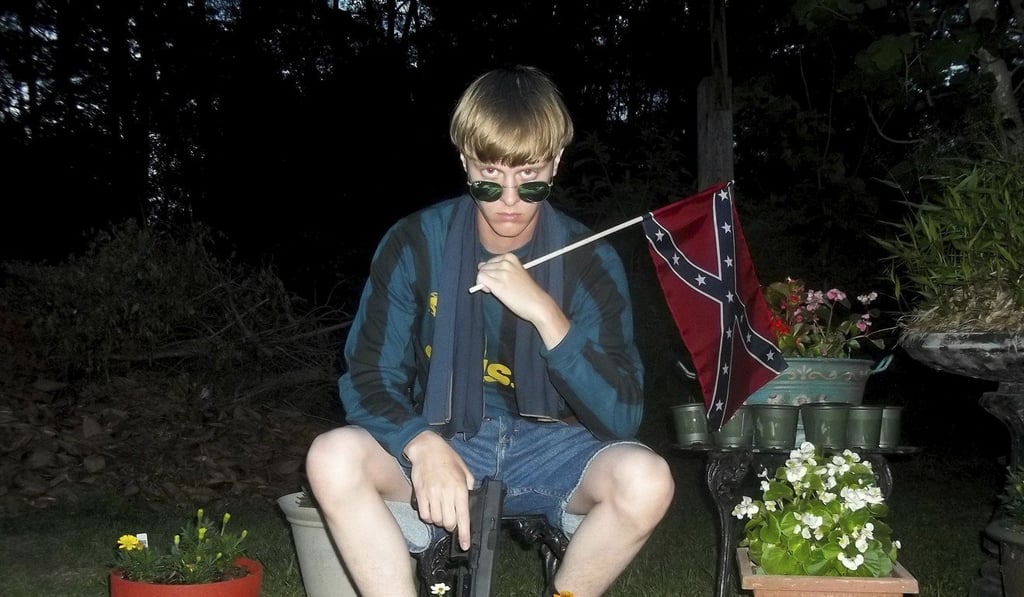 An undated photo that appeared on Lastrhodesian.com, a website investigated by the FBI in connection with Dylann Roof, shows him posing for a photo holding a Confederate flag. Roof said he would rather get the death penalty than be called autistic. Photo: Lastrhodesian.com via AP