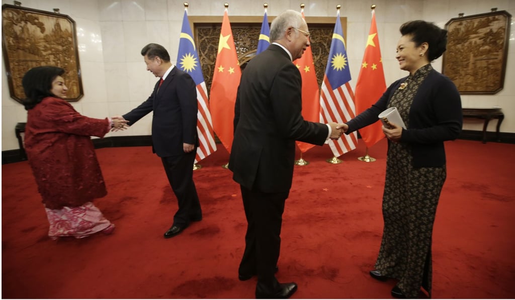 Malaysian Prime Minister Najib Razak and his wife Rosmah Mansor meet Chinese President Xi Jinping and his wife Peng Liyuan at the Diaoyutai State Guesthouse in Beijing. Photo: AFP Malaysian Prime Minister Najib Razak and his wife Rosmah Mansor meet Chinese President Xi Jinping and his wife Peng Liyuan at the Diaoyutai State Guesthouse in Beijing. Photo: AFP