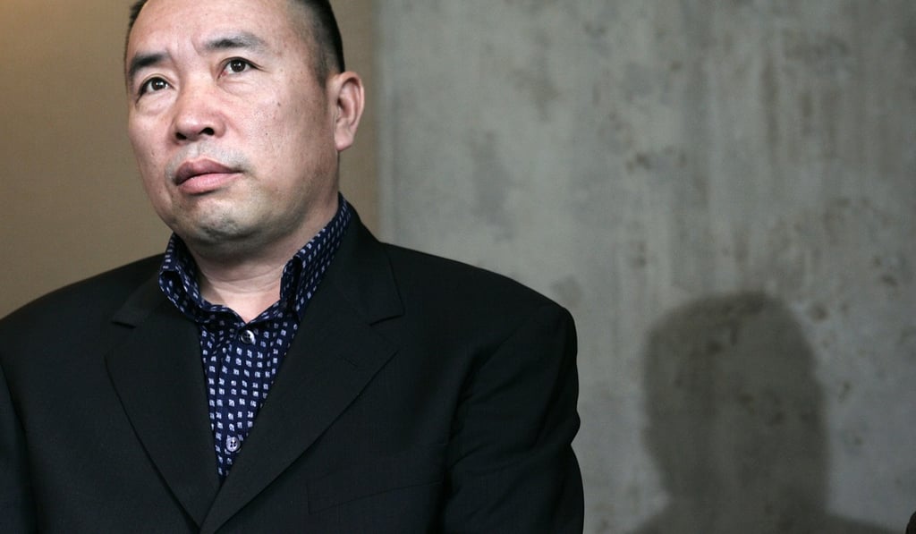 Chinese fugitive Lai Changxing listens to questions from reporters in Vancouver, British Columbia, on April 5, 2007. Photo: Reuters